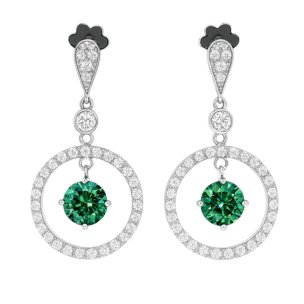 Pair of earrings with green gemstones and circular designs on a white background
