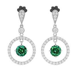 Pair of earrings with green gemstones and circular designs on a white background
