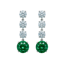 Pair of earrings with green gemstones and clear stones on a white background
