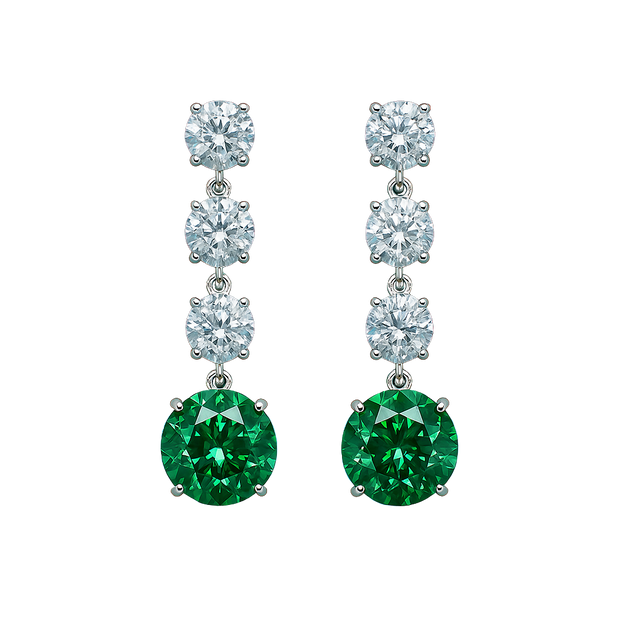Pair of earrings with green gemstones and clear stones on a white background