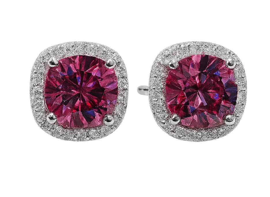 Pair of earrings with pink gemstones and silver accents on a white background