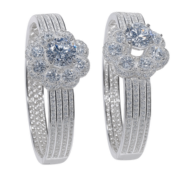 Pair of silver earrings with gemstones on a white background