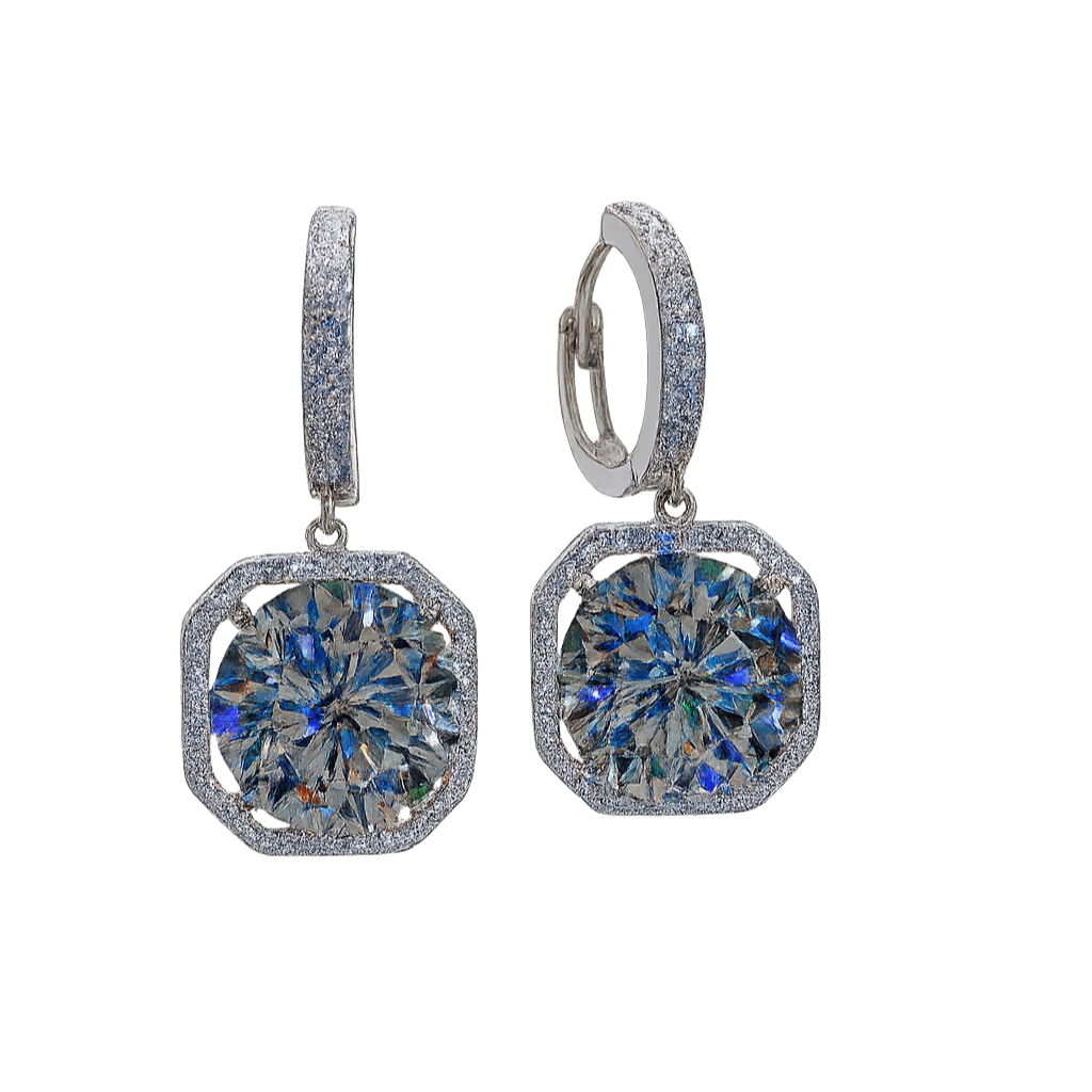 Pair of silver earrings with blue gemstones on a white background