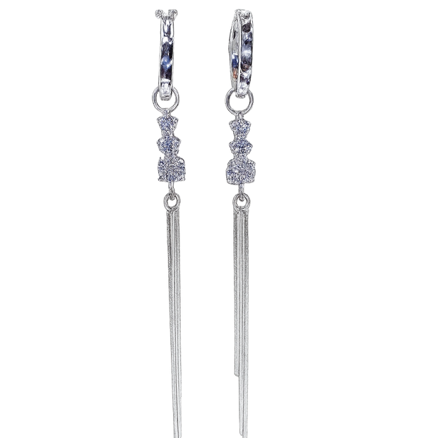 Pair of silver earrings with dangling elements on a white background