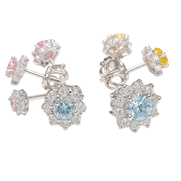 Pair of silver earrings with gemstones on a white background