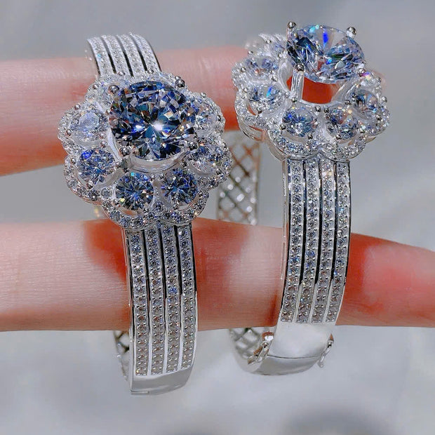 Pair of silver hoop earrings with gemstones on a blurred background