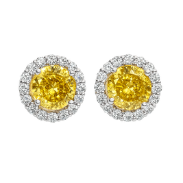 Pair of yellow gemstone earrings with silver halo on a white background
