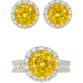 Pair of yellow gemstone earrings with silver halo on a white background