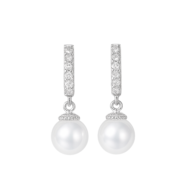 Pearl earrings with diamond accents on a white background