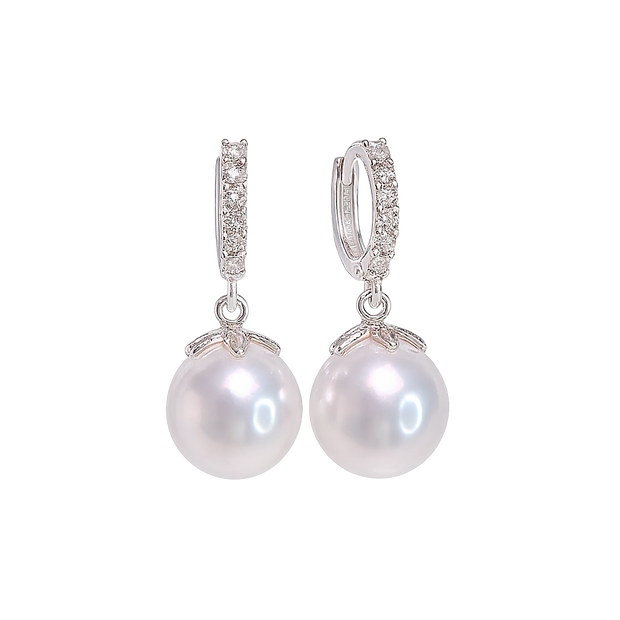 Pearl earrings with silver clasps on a white background