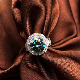 Ring with a large gemstone on a brown fabric background