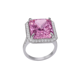 Ring with a pink gemstone and diamond-studded band on a white background