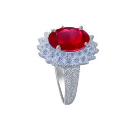 Ring with a red gemstone and diamond-studded band on a white background