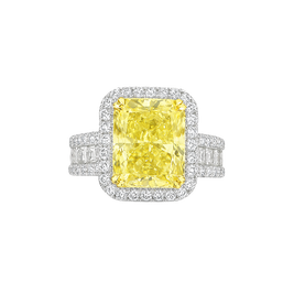 Ring with a yellow diamond and white gemstones on a white background