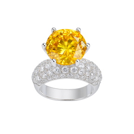 Ring with a yellow gemstone and diamond-studded band on a white background
