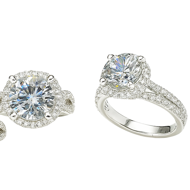 Set of diamond jewelry including rings and earrings on a white background