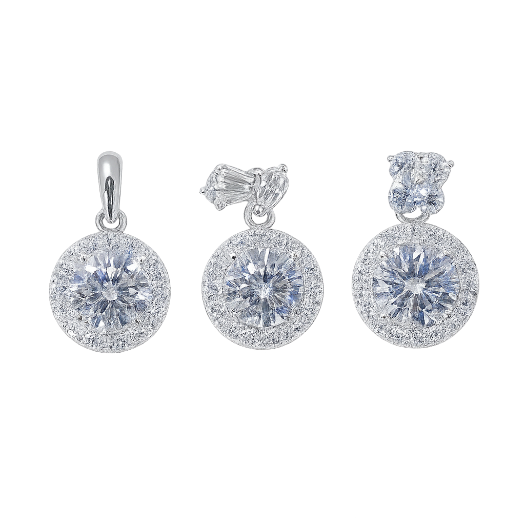 Set of silver earrings with clear gemstones on a white background