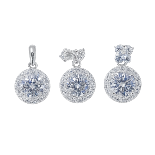 Set of silver earrings with clear gemstones on a white background