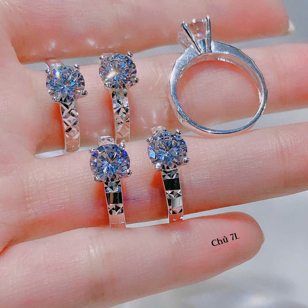 Set of silver rings with gemstones on a hand