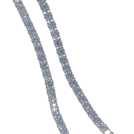 Silver bracelet with clear stones on a white background