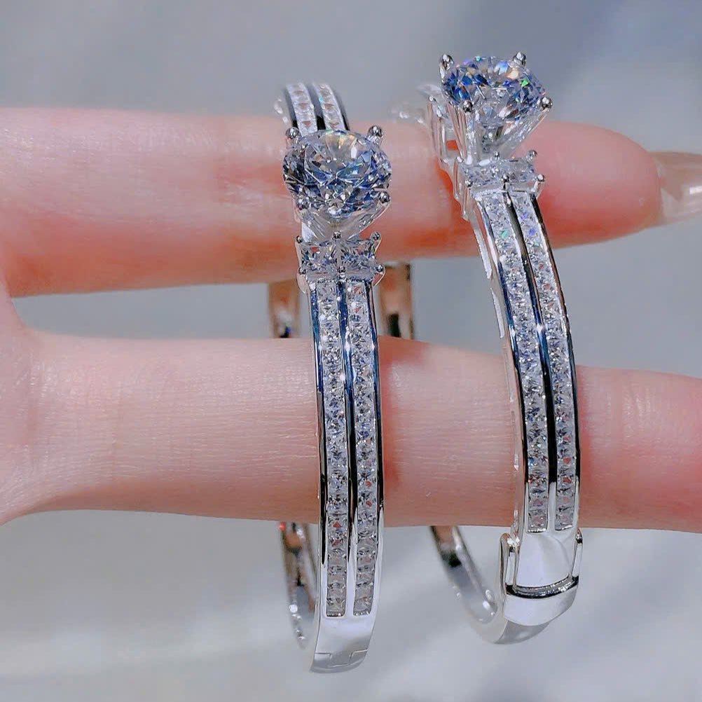 Silver bracelet with gemstones on a blurred background