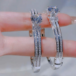 Silver bracelet with gemstones on a blurred background