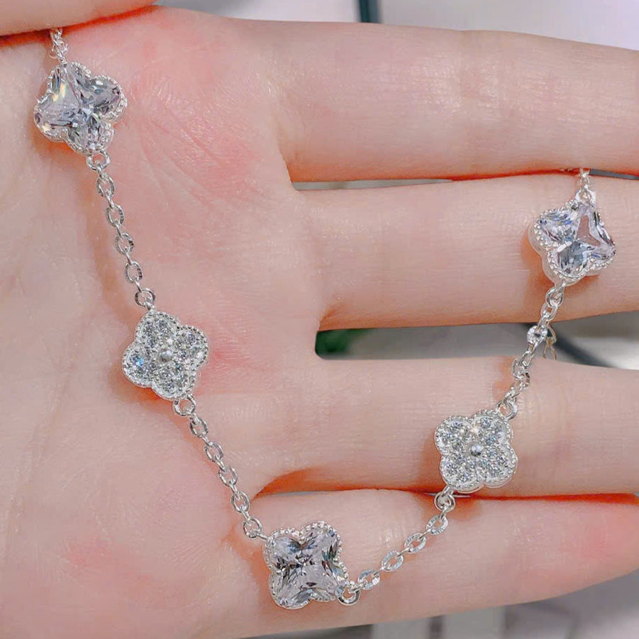Silver bracelet with heart-shaped crystals on a hand
