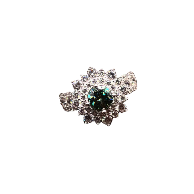 Silver brooch with a central green gemstone on a white background