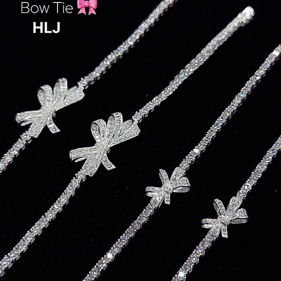 Silver hair accessories with bow designs on a black background, featuring the brand 'Bow Tie HLJ'.