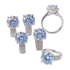 Silver jewelry set with large gemstones on a white background