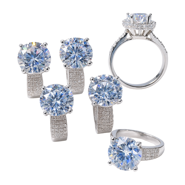 Silver jewelry set with large gemstones on a white background