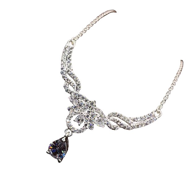 Silver necklace with a teardrop-shaped purple gemstone on a white background