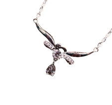 Silver necklace with a bow-shaped pendant on a white background