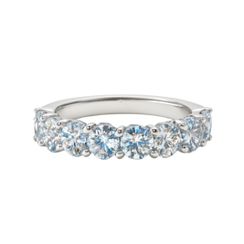 Silver ring with clear gemstones on a white background