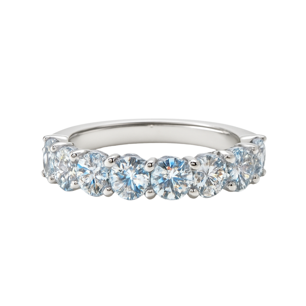 Silver ring with clear gemstones on a white background