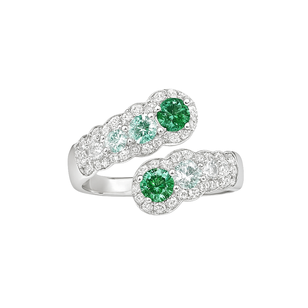 Silver ring with green gemstones on a white background
