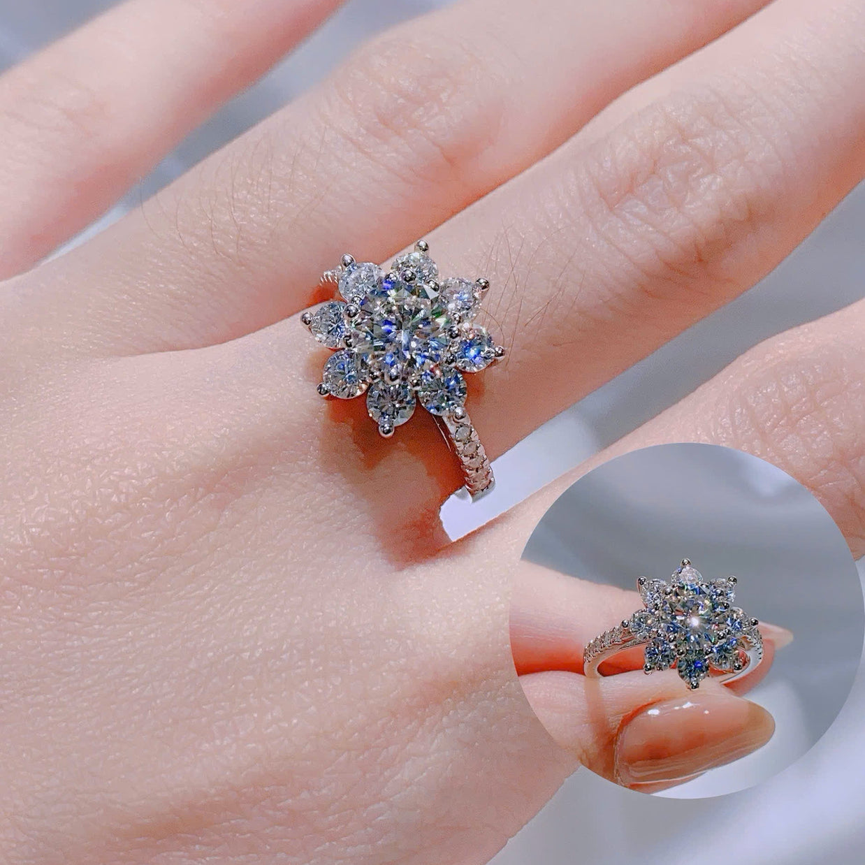 Star-shaped diamond ring on a hand with a blurred background
