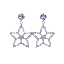 Star-shaped silver earrings with clear gemstones on a white background
