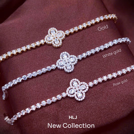 Three diamond bracelets in gold, white gold, and rose gold on a brown fabric background.