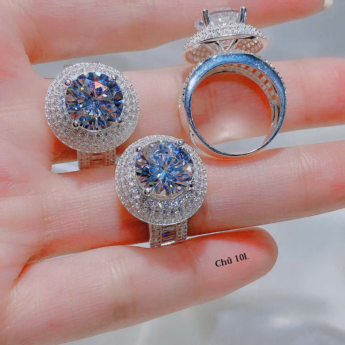 Three diamond rings on a hand with a blurred background