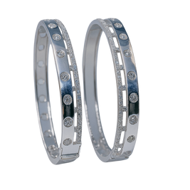 Two silver bangles with embedded stones on a white background