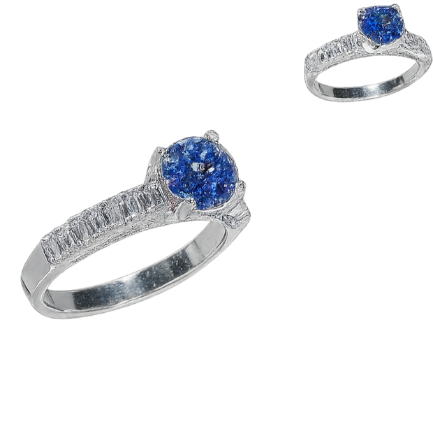 Two silver rings with blue gemstones on a white background