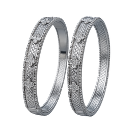 Two silver rings with floral and diamond designs on a white background