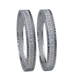 Two silver wedding bands with diamond accents on a white background