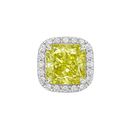 Yellow diamond ring with white gold prongs on a white background