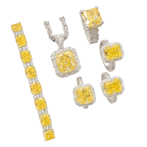 Jewelry set with yellow gemstones on a white background