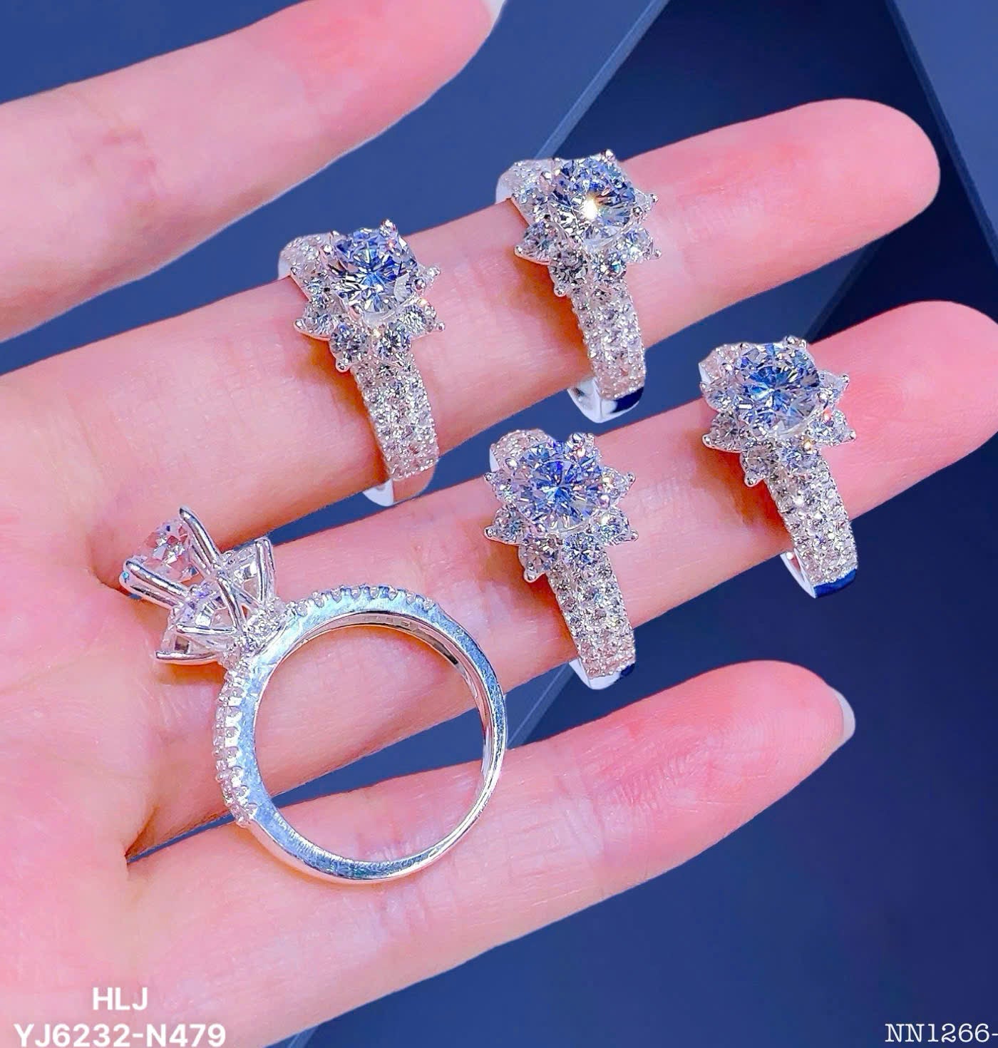 Set of diamond rings on a hand with a blue background