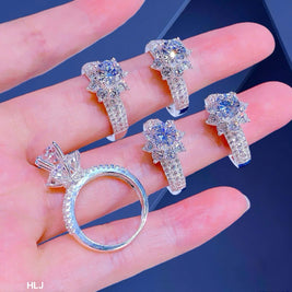 Set of diamond rings on a hand with a blue background